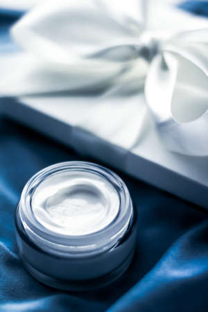 Cosmetic branding, moisturizing emulsion and facial care concept - Luxury face cream moisturizer for sensitive skin, spa cosmetics and natural skincare product as beauty brand holiday gift on blueの写真素材