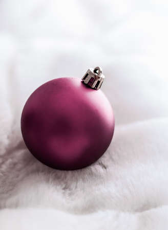 Gift decor, New Years Eve and happy celebration concept - Purple Christmas baubles on white fluffy fur backdrop, luxury winter holiday design backgroundの写真素材