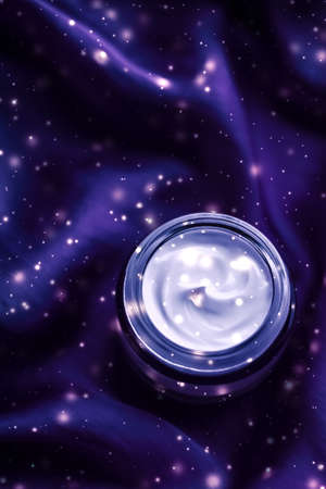 Winter cosmetics, luxe body care and Christmas gift concept - Magic night face cream as beauty skin moisturizer, luxury spa cosmetic and natural clean skincare product with holiday shiny glitterの写真素材