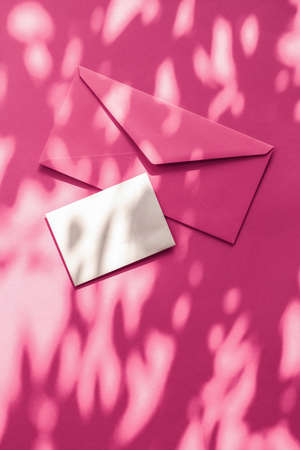 Holiday marketing, business kit and email newsletter concept - Beauty brand identity as flatlay mockup design, business card and letter for online luxury branding on pink shadow backgroundの写真素材