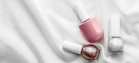 Cosmetic branding, salon and glamour concept - Nail polish bottles on silk background, french manicure products and nailpolish make-up cosmetics for luxury beauty brand and holiday flatlay art designの写真素材