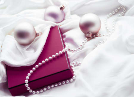 Holidays branding, happy giving and decoration concept - Christmas holiday background, festive baubles and purple vintage gift box as winter season present for luxury brand designの写真素材
