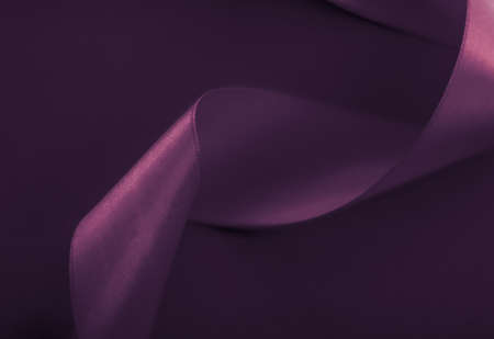 Branding, holidays and luxe brands concept - Abstract curly silk ribbon on purple background, exclusive luxury brand design for holiday sale product promotion and glamour art invitation card backdropの写真素材