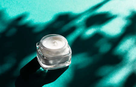 Luxe cosmetics, anti-age moisturizer and organic science concept - Beauty face cream for sensitive skin, moisturizing luxury spa cosmetic and natural complexion skincare product on emerald backgroundの写真素材