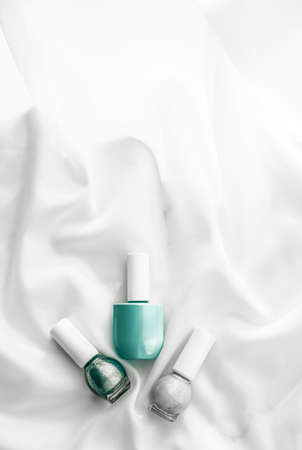 Cosmetic branding, salon and glamour concept - Nail polish bottles on silk background, french manicure products and nailpolish make-up cosmetics for luxury beauty brand and holiday flatlay art designの写真素材
