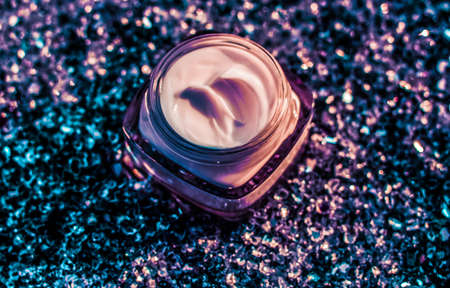Cosmetic branding, sunscreen spf and facial care concept - Luxury face cream for healthy skin on shiny glitter sunlight background, moisturizing cosmetics and natural skincare beauty brand productの写真素材