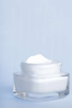 Cosmetic branding, toiletries and spf concept - Face cream moisturizer jar on blue background, moisturizing skin care lotion and lifting emulsion, anti-age cosmetics for luxury beauty skincare brandの写真素材