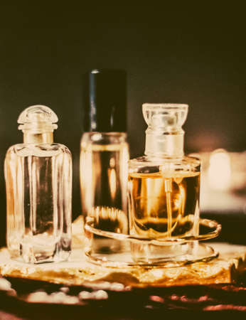Perfumery, cosmetic branding and spa concept - Perfume bottles and vintage fragrance at night, aroma scent, fragrant cosmetics and eau de toilette as luxury beauty brand, holiday fashion parfum designの写真素材