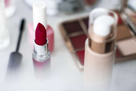 Cosmetic branding, girly and glamour concept - Cosmetics, makeup products on dressing vanity table, lipstick, foundation base, nailpolish and eyeshadows for luxury beauty and fashion brand ads designの写真素材