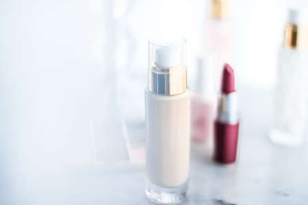 Cosmetic branding, girly and glamour concept - Cosmetics, makeup products on dressing vanity table, lipstick, foundation base, nailpolish and eyeshadows for luxury beauty and fashion brand ads designの写真素材