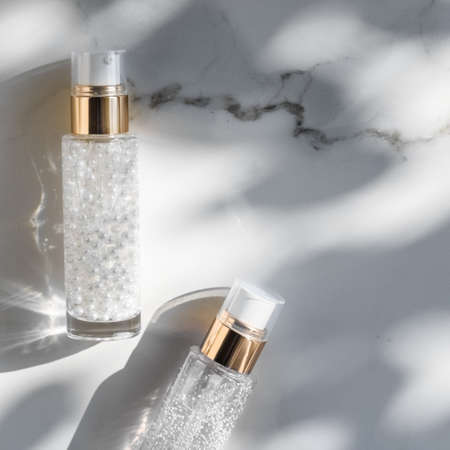 Cosmetic branding, packaging and make-up concept - Skin care serum and gel bottle, moisturizing...