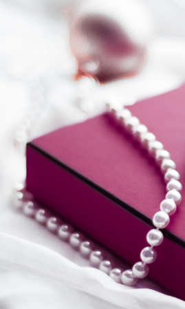 Holidays branding, happy giving and decoration concept - Christmas holiday background, festive baubles and purple vintage gift box as winter season present for luxury brand designの写真素材