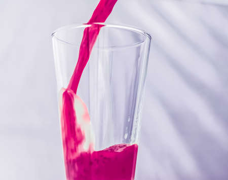 Branding, fasting and cleanse concept - Berry fruit juice in glass, vegan smoothie with chia for...