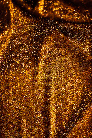 Luxe glowing texture, night club branding and New Years party concept - Bronze holiday sparkling glitter abstract background, luxury shiny fabric material for glamour design and festive invitationの写真素材