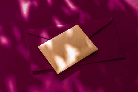 Holiday marketing, business kit and email newsletter concept - Beauty brand identity as flatlay mockup design, business card and letter for online luxury branding on maroon shadow backgroundの写真素材