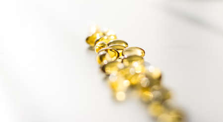 Pharmaceutical, branding and science concept -  Vitamin D and golden Omega 3 pills for healthy diet...