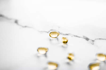 Pharmaceutical, branding and science concept -  Vitamin D and golden Omega 3 pills for healthy diet...
