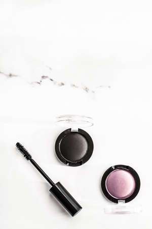 Cosmetic branding, blog and girly concept - Eyeshadows, black liner and mascara on marble background, eye shadows cosmetics as glamour make-up products for luxury beauty brand, holiday flatlay designの写真素材