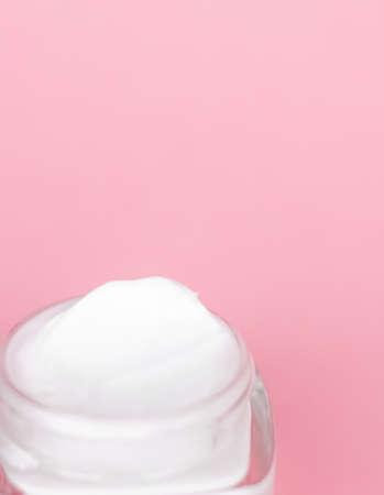 Cosmetic branding, toiletries and spf concept - Face cream moisturizer jar on pink background,...
