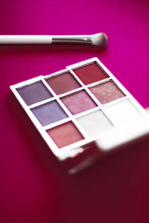 Cosmetic branding, mua and girly concept - Eyeshadow palette and make-up brush on cherry background, eye shadows cosmetics product for luxury beauty brand promotion and holiday fashion blog designの写真素材