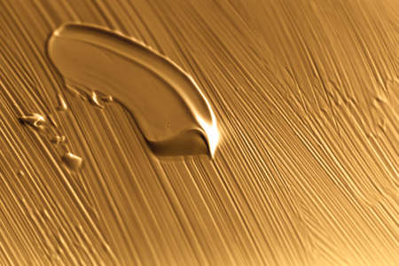 Art, branding and makeup concept - Cosmetics abstract texture background, golden acrylic paint brush stroke, textured cream product as make-up backdrop for luxury beauty brand, holiday banner designの写真素材