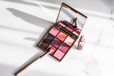 Cosmetic branding, girly and glamour concept - Cosmetics, makeup products set on marble vanity table, lipstick, eyeshadows and make-up brush for luxury beauty and fashion brand ads, holiday designの写真素材