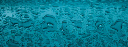Liquid, wet and zen concept - Water texture abstract background, aqua drops on turquoise glass as science macro element, rainy weather and nature surface art backdrop for environmental brand designの写真素材