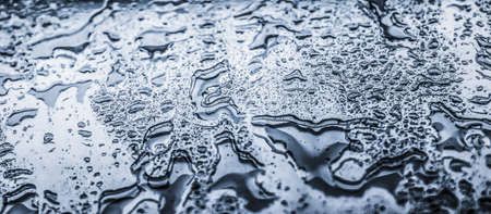 Liquid, wet and zen concept - Water texture abstract background, aqua drops on silver glass as...