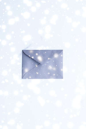 Greetings, postal service and online newsletter concept - Winter holiday blank paper envelopes on...