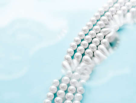 Jewelry, branding and gems concept - Coastal jewellery fashion, pearl necklace under blue water background, glamour style present and chic gift for luxury jewelery brand, holiday banner designの写真素材