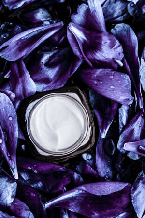 Cosmetic branding, moisturizing and anti-age - Luxury face cream moisturizer for facial skin on blue flower background, floral essense, spa cosmetics and beauty emulsion for skincare brand productの写真素材