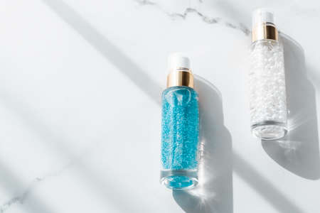 Cosmetic branding, packaging and make-up concept - Skin care serum and gel bottle, moisturizing...