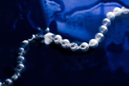 Jewelry, branding and gems concept - Coastal jewellery fashion, pearl necklace under blue water background, glamour style present and chic gift for luxury jewelery brand, holiday banner designの写真素材