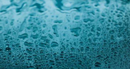 Liquid, wet and zen concept - Water texture abstract background, aqua drops on turquoise glass as...