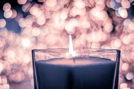 Festive decoration, branding and aromatherapy spa concept - Blue aromatic candle on Christmas and New Years glitter background, Valentines Day luxury home decor and holiday season brand designの写真素材