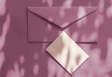 Holiday marketing, business kit and email newsletter concept - Beauty brand identity as flatlay mockup design, business card and letter for online luxury branding on purple shadow backgroundの写真素材
