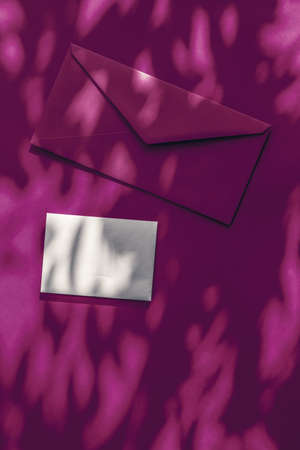 Holiday marketing, business kit and email newsletter concept - Beauty brand identity as flatlay mockup design, business card and letter for online luxury branding on purple shadow backgroundの写真素材