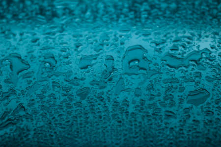 Liquid, wet and zen concept - Water texture abstract background, aqua drops on turquoise glass as...