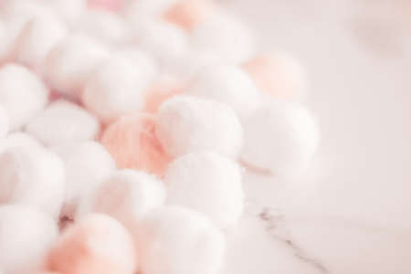 Cosmetology, branding and cleanliness concept - Organic cotton balls background for morning routine, spa cosmetics, hygiene and natural skincare beauty brand product as healthcare and medical designの写真素材