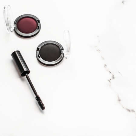 Cosmetic branding, blog and girly concept - Eyeshadows, black liner and mascara on marble background, eye shadows cosmetics as glamour make-up products for luxury beauty brand, holiday flatlay designの写真素材