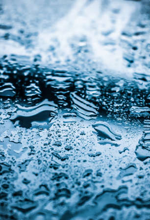 Liquid, wet and zen concept - Water texture abstract background, aqua drops on blue glass as science...