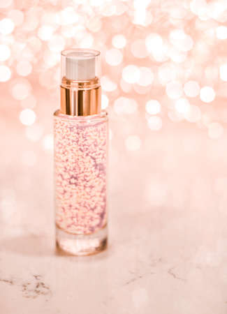 Cosmetic branding, blank label and glamour present concept - Holiday make-up base gel, serum emulsion, lotion bottle and rose gold glitter, luxury skin and body care cosmetics for beauty brand adsの写真素材