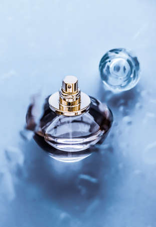 Perfumery, cosmetics and branding concept - Perfume bottle under blue water, fresh sea coastal scent as glamour fragrance and eau de parfum product as holiday gift, luxury beauty spa brand presentの写真素材