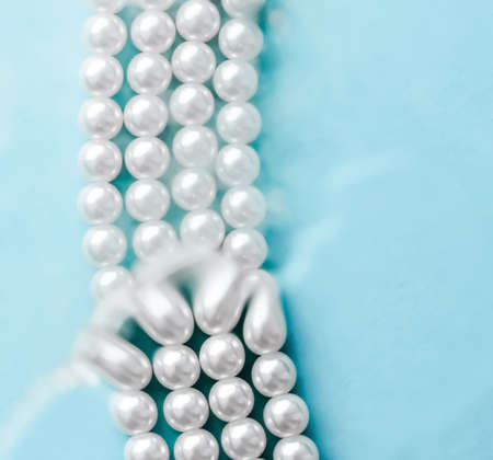 Jewelry, branding and gems concept - Coastal jewellery fashion, pearl necklace under blue water background, glamour style present and chic gift for luxury jewelery brand, holiday banner designの写真素材
