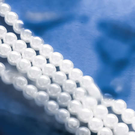 Jewelry, branding and gems concept - Coastal jewellery fashion, pearl necklace under blue water background, glamour style present and chic gift for luxury jewelery brand, holiday banner designの写真素材