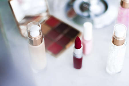 Cosmetic branding, girly and glamour concept - Cosmetics, makeup products on dressing vanity table, lipstick, foundation base, nailpolish and eyeshadows for luxury beauty and fashion brand ads designの写真素材