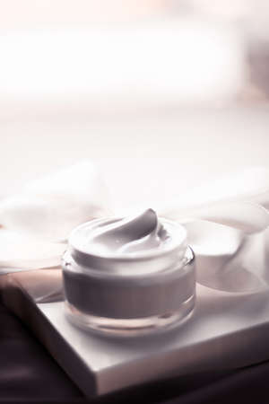 Organic cosmetics, luxe present and natural cosmetology concept - Beauty face cream skin moisturizer, luxury spa cosmetic and natural clean skincare product and holiday gift on dark silkの写真素材