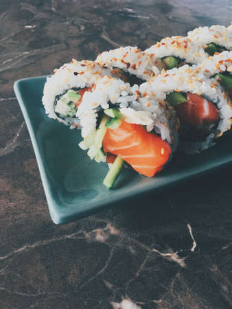 Food, travel and healthy eating concept - Japanese sushi in a restaurant at lunch time, asian cuisineの写真素材