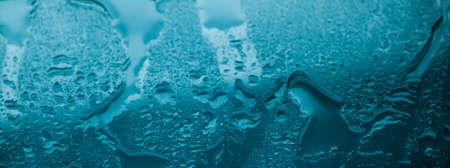 Liquid, wet and zen concept - Water texture abstract background, aqua drops on turquoise glass as science macro element, rainy weather and nature surface art backdrop for environmental brand designの写真素材