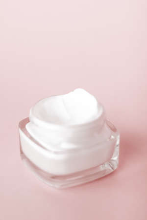 Cosmetic branding, toiletries and spf concept - Face cream moisturizer jar on beige background, moisturizing skin care lotion and lifting emulsion, anti-age cosmetics for luxury beauty skincare brandの写真素材